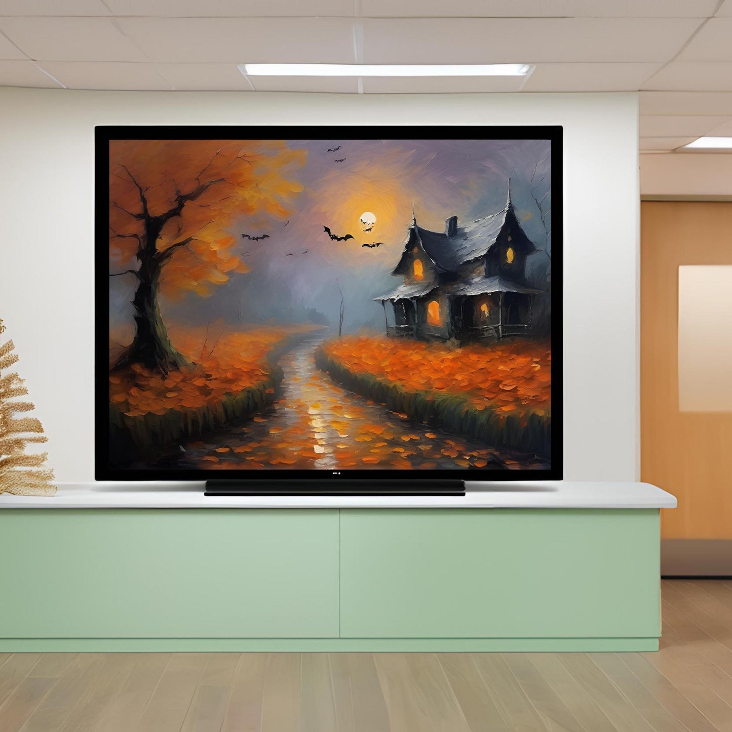 a painting of a halloween scene on a flat screen tv