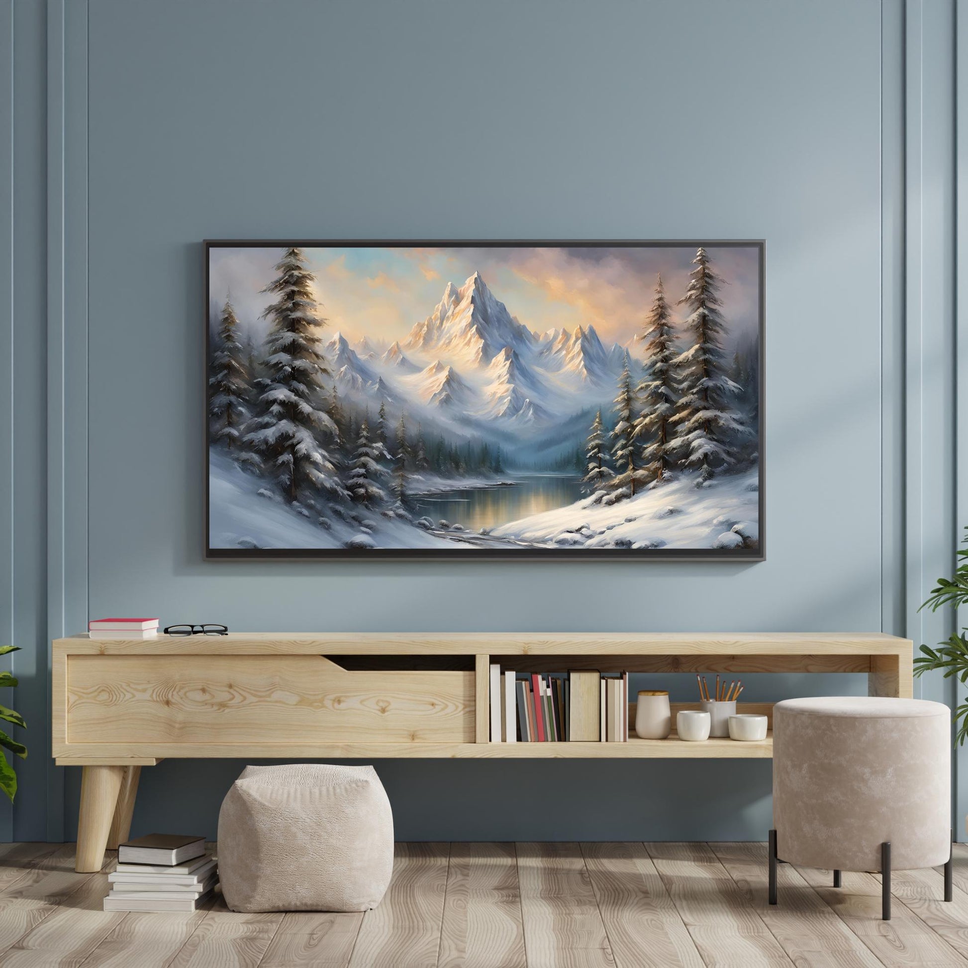 a painting of a snowy mountain scene hangs on a wall